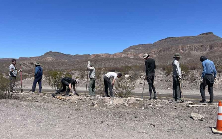 a group of students participate in a service project in texas